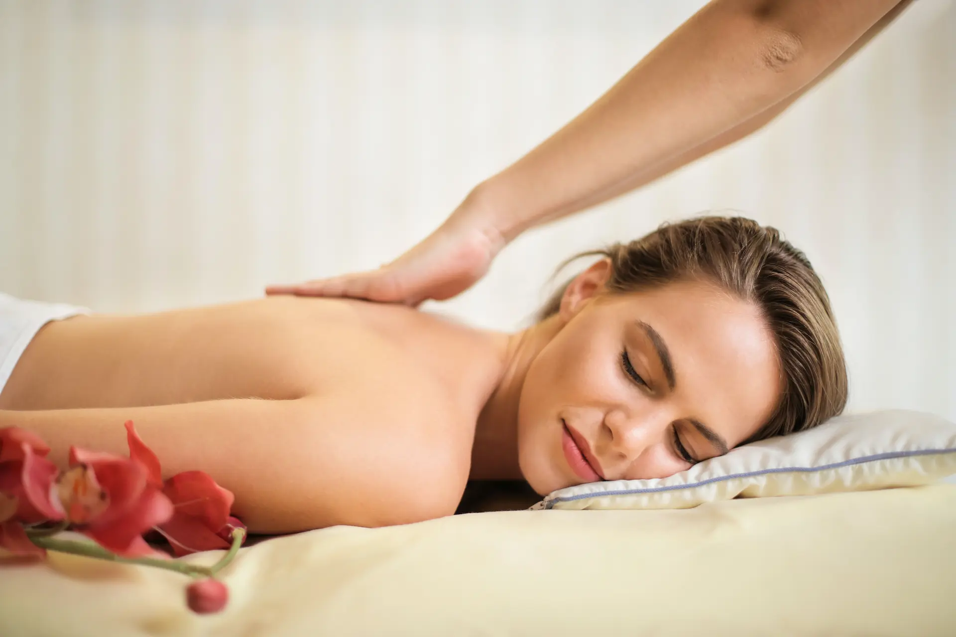 The woman settles into a state of relaxation while receiving a Swedish Massage.